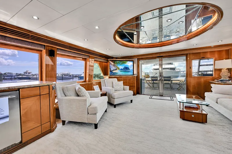 Slide: The Image of Luxurious interior of 2001 Hargrave 94 yacht with elegant seating and panoramic windows. - 12