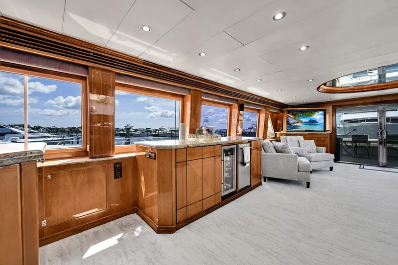 Slide: The Image of Luxurious interior of 2001 Hargrave 94 yacht with panoramic windows and elegant furnishings. - 13
