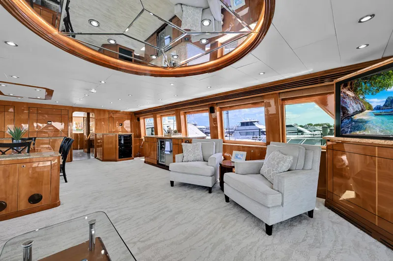 Slide: The Image of Luxurious interior of a 2001 Hargrave 94 yacht with elegant furnishings and panoramic windows. - 15