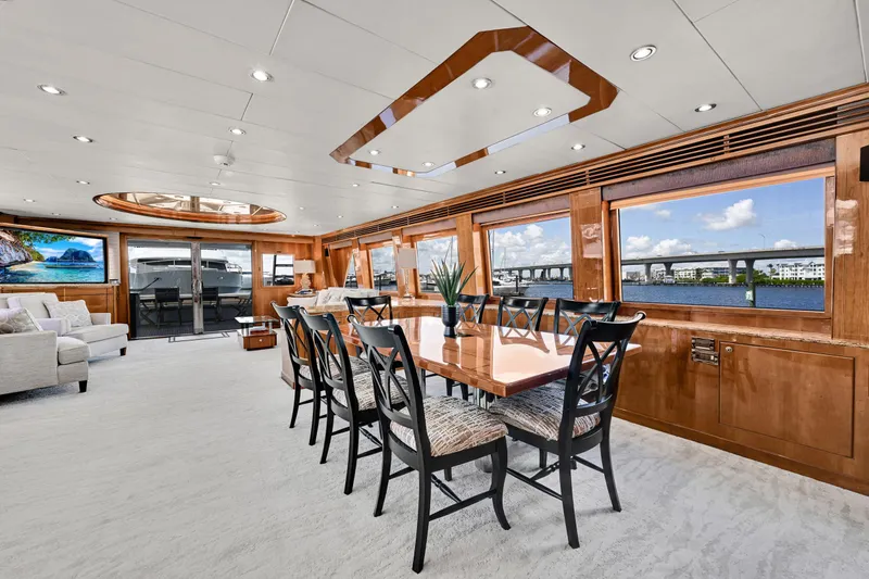 Slide: The Image of Luxurious interior of 2001 Hargrave 94 yacht with elegant dining area and scenic water views. - 17