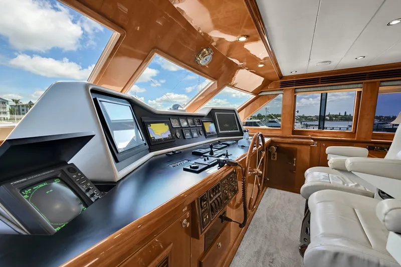 Slide: The Image of Luxurious 2001 Hargrave 94 yacht helm with advanced navigation systems and plush seating. - 32