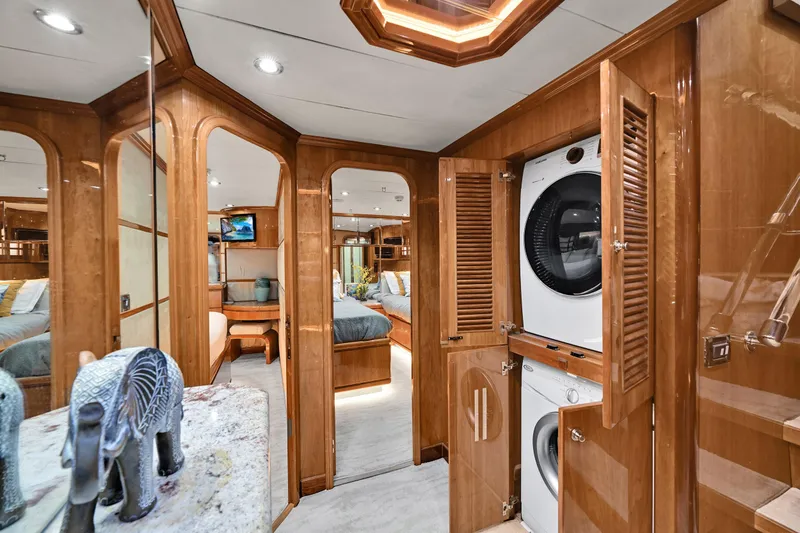 Slide: The Image of Luxurious interior of 2001 Hargrave 94 yacht featuring wood paneling and modern amenities. - 44