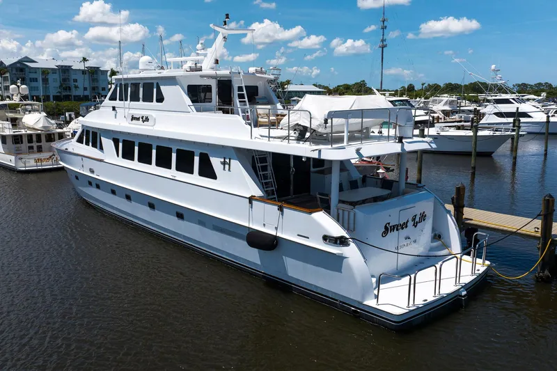 Slide: The Image of Luxury Hargrave 94 yacht from 2001 docked at marina under blue sky. - 5