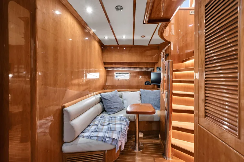 Slide: The Image of Luxurious interior of 2001 Hargrave 94 yacht with cozy seating and elegant wood finishes. - 51