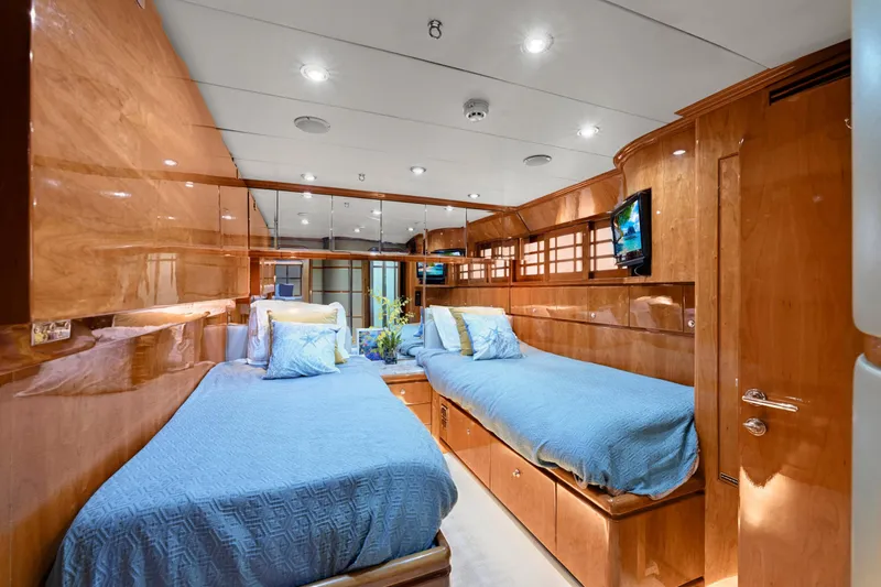 Slide: The Image of Luxurious 2001 Hargrave 94 yacht cabin with twin beds and elegant wood paneling. - 64