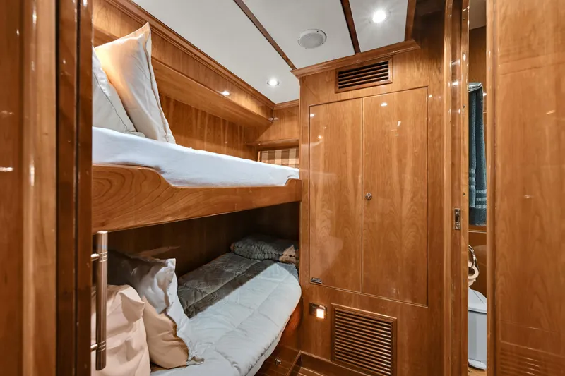 Slide: The Image of Luxurious wooden cabin interior with bunk beds on a 2001 Hargrave 94 yacht. - 66