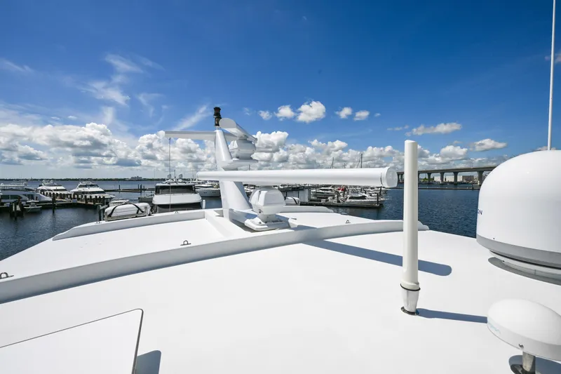Slide: The Image of Rooftop view of 2001 Hargrave 94 yacht docked at marina under blue sky. - 76