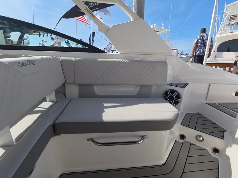 Slide: The Image of The 2027 Sea Ray SDX 270 Outboard features a sleek bench seat with gray upholstery. - 12