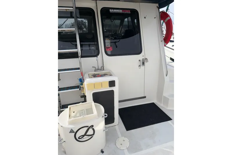 Slide: The Image of 1990 Mediterranean Sport Fish boat deck with equipment and safety gear. - 20