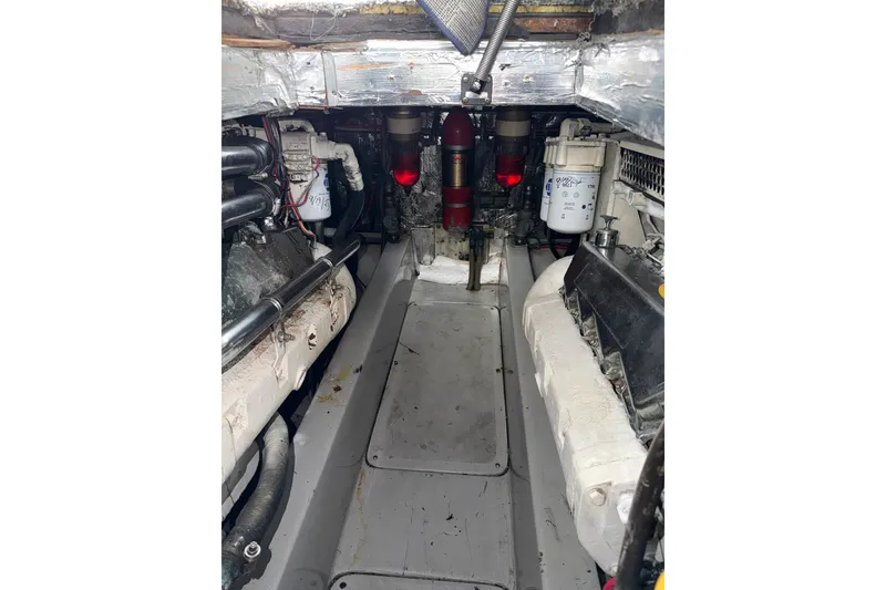 Slide: The Image of Engine room of a 1990 Mediterranean Sport Fish boat, showcasing mechanical components. - 21