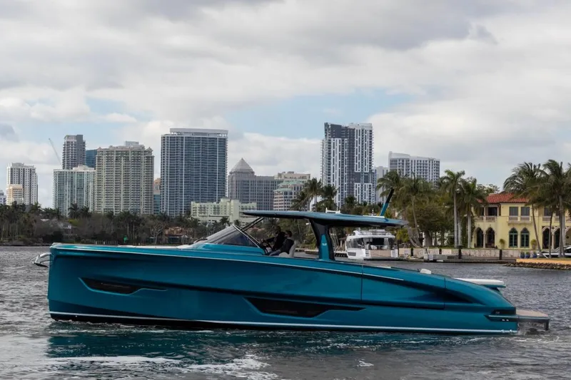 Slide: The Image of 2024 Solaris Power 52 Open yacht cruising near city skyline. - 11