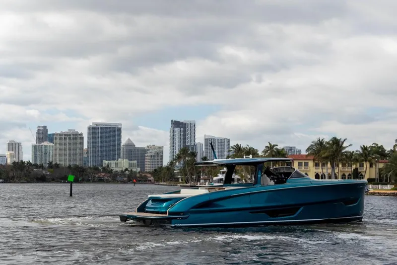 Slide: The Image of 2024 Solaris Power 52 Open yacht cruising near city skyline. - 14