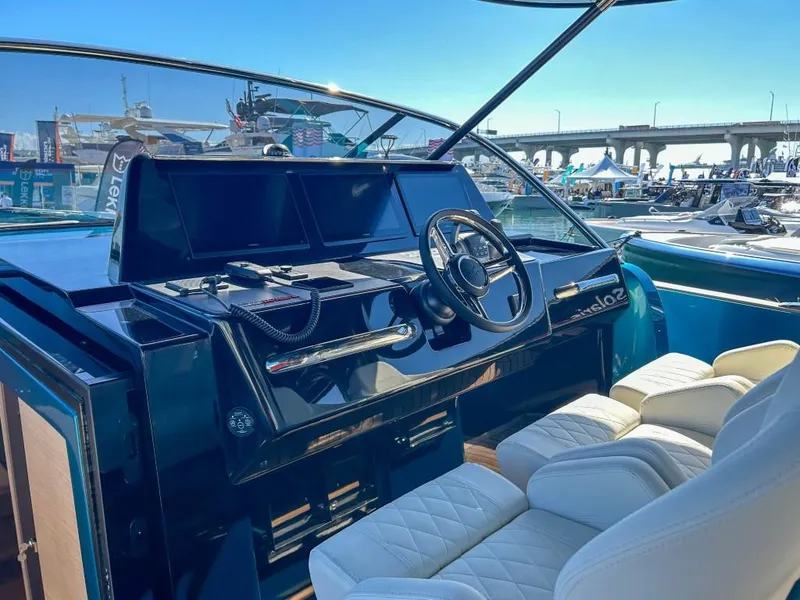 Slide: The Image of Helm of 2024 Solaris Power 52 Open yacht with luxurious seating and modern controls. - 22