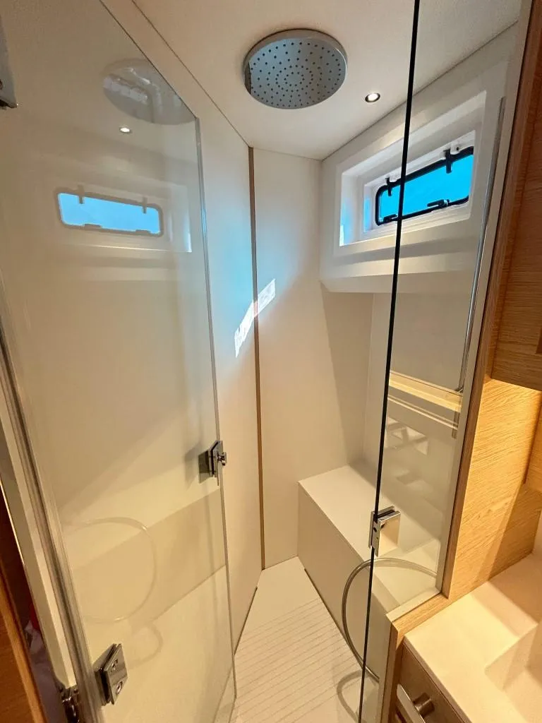 Slide: The Image of 2024 Solaris Power 52 Open yacht bathroom with modern shower and sleek design. - 29