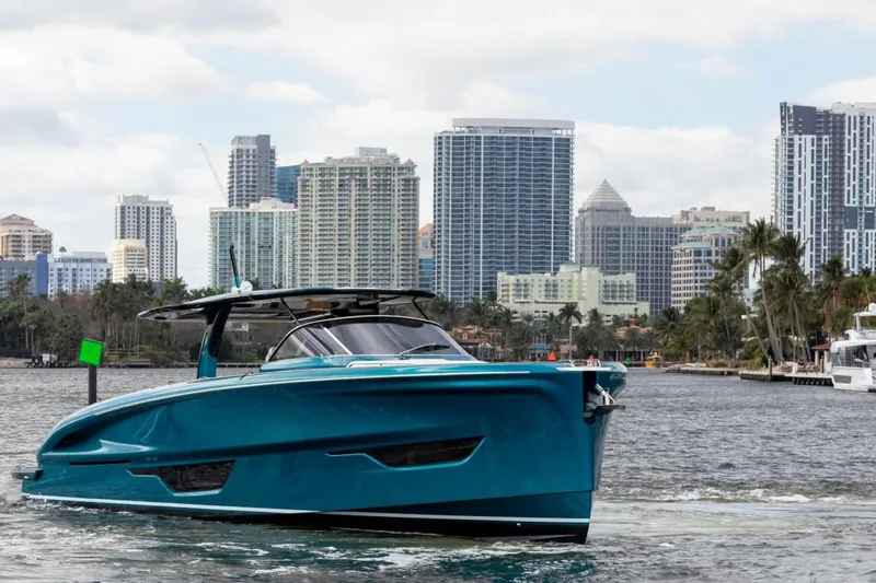 Slide: The Image of 2024 Solaris Power 52 Open yacht cruising near city skyline. - 8
