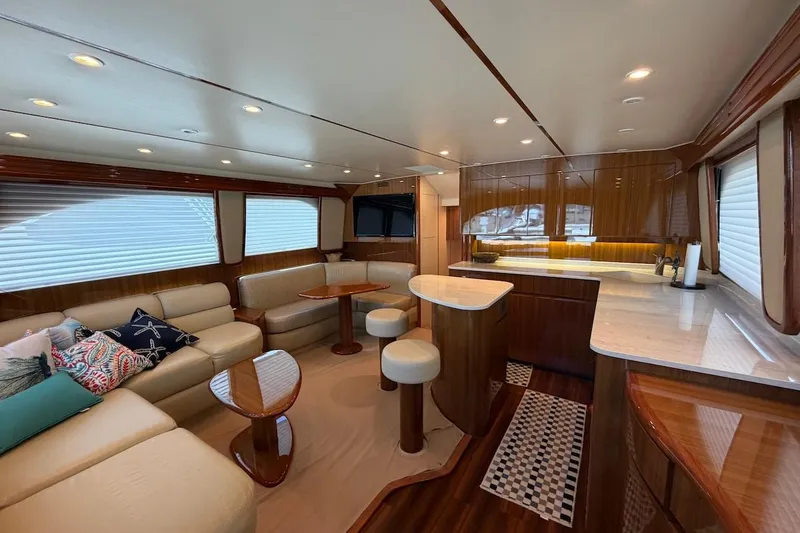Slide: The Image of Luxurious interior of a 2012 Viking 50 Convertible yacht with elegant seating and modern amenities. - 20