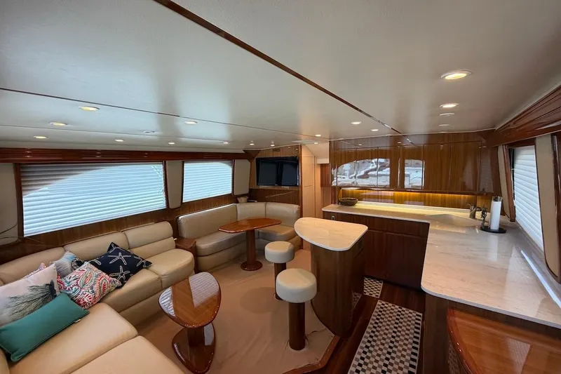Slide: The Image of Luxurious interior of a 2012 Viking 50 Convertible yacht with elegant seating and modern kitchen. - 21
