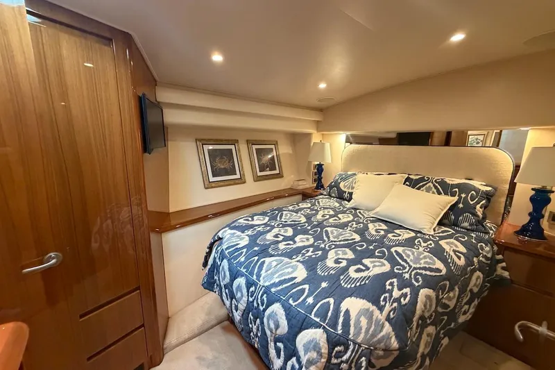 Slide: The Image of Luxurious bedroom interior of 2012 Viking 50 Convertible yacht with elegant bedding and decor. - 25