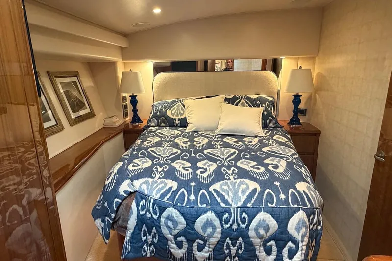 Slide: The Image of Luxurious bedroom interior of 2012 Viking 50 Convertible yacht with elegant decor and bedding. - 26