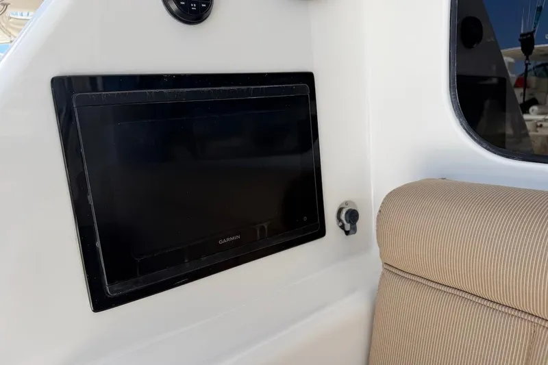 Slide: The Image of Garmin display on 2012 Viking 50 Convertible yacht, featuring beige seating. - 39