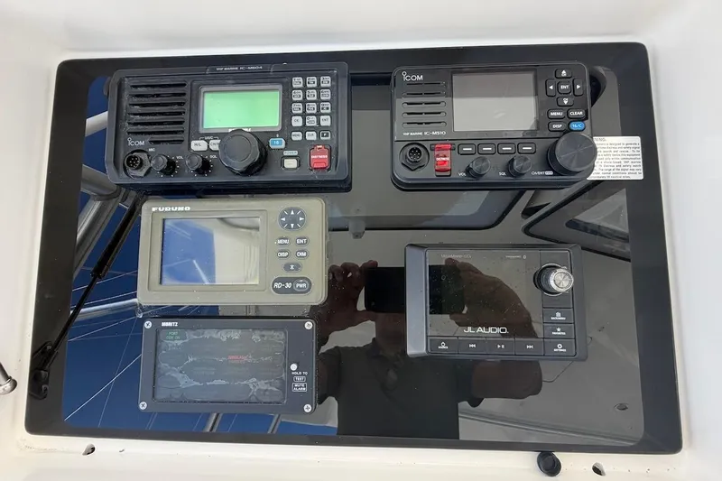 Slide: The Image of Control panel of a 2012 Viking 50 Convertible yacht with navigation and audio equipment. - 45