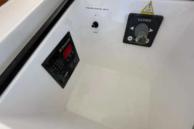 Slide: The Image of Control panel of a 2012 Viking 50 Convertible boat featuring Dometic and Sleipner systems. - 48