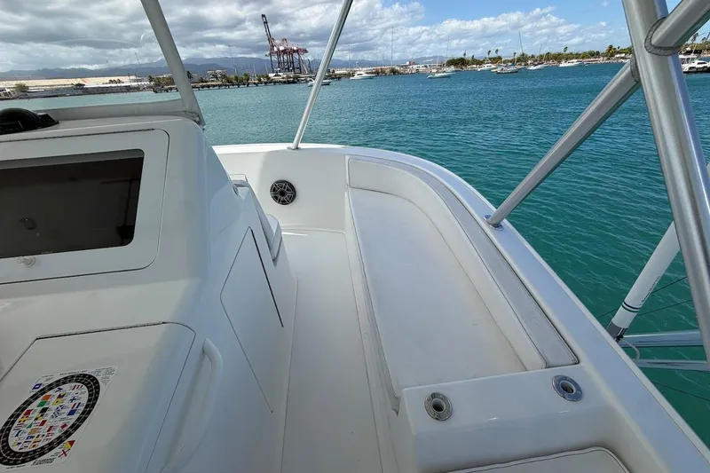 Slide: The Image of 2012 Viking 50 Convertible yacht deck with ocean view and marina backdrop. - 49