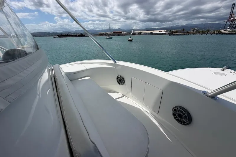 Slide: The Image of 2012 Viking 50 Convertible yacht deck with ocean view and cloudy sky. - 50