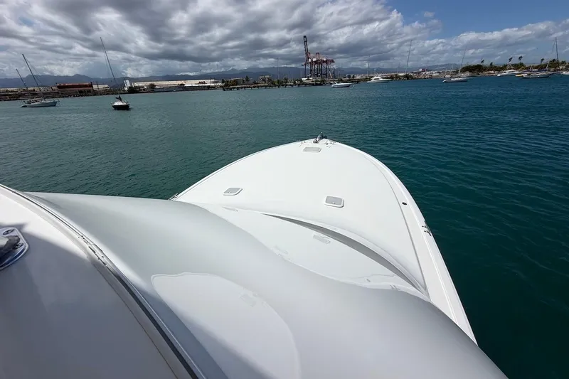 Slide: The Image of Viking 50 Convertible yacht cruising in a scenic harbor, 2012 model. - 51