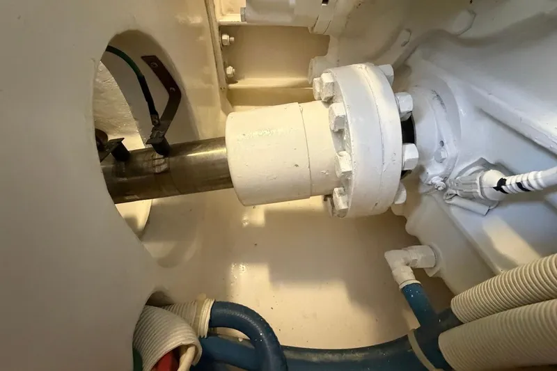 Slide: The Image of Engine room detail of a 2012 Viking 50 Convertible yacht, showcasing mechanical components. - 57