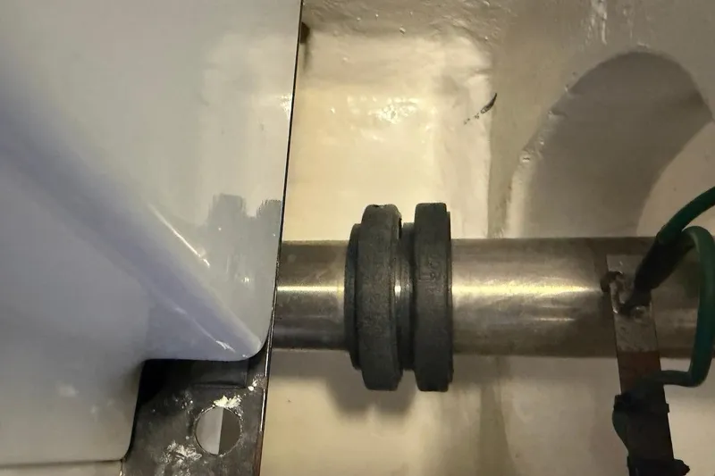 Slide: The Image of Close-up of a 2012 Viking 50 Convertible boat's shaft and coupling assembly. - 58