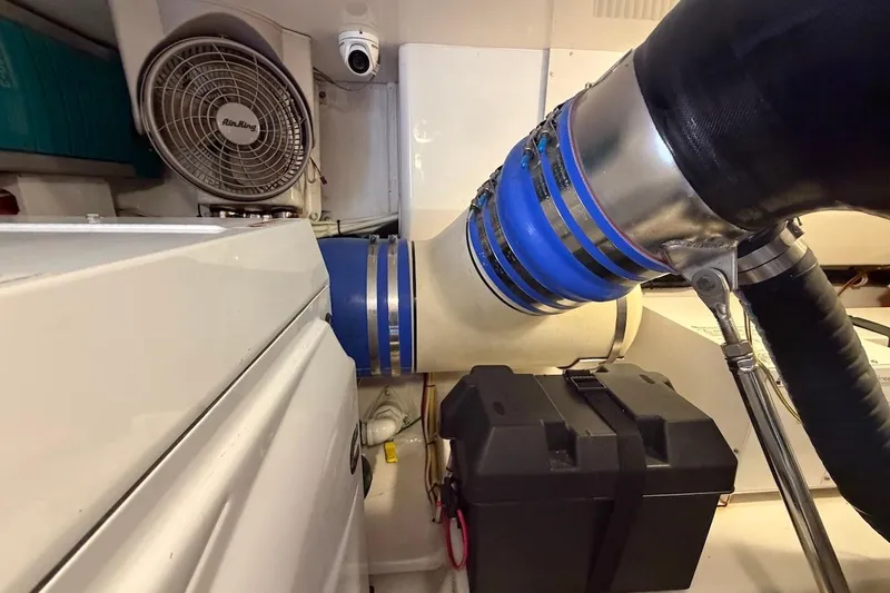 Slide: The Image of Engine room of 2012 Viking 50 Convertible yacht with ventilation and piping system. - 61