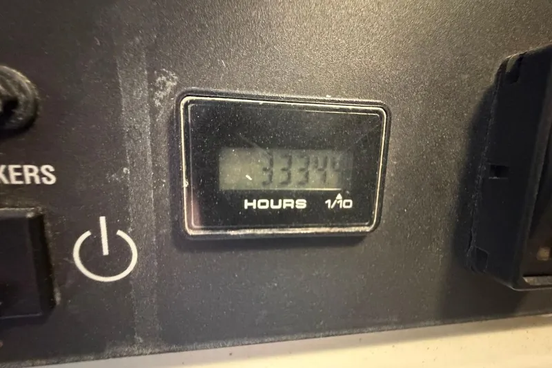 Slide: The Image of Hour meter reading 3344 on 2012 Viking 50 Convertible boat dashboard. - 63