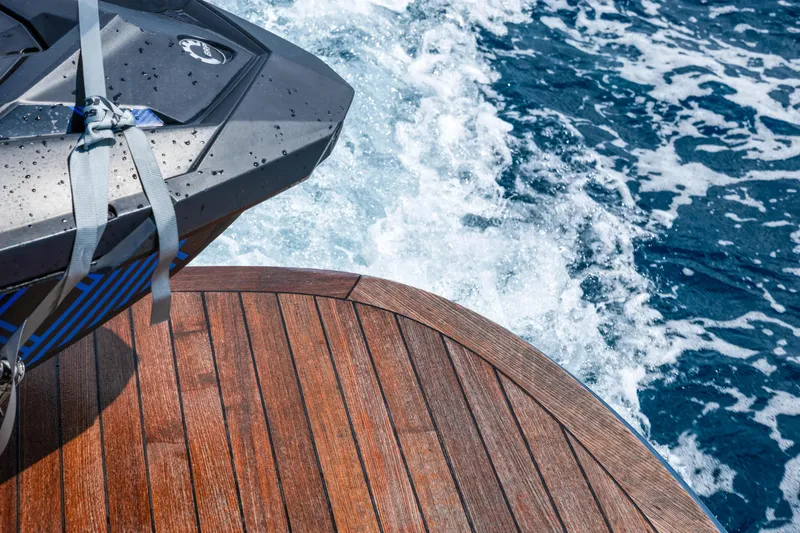 Slide: The Image of 2024 Solaris Power 44 Open yacht deck with ocean waves in the background. - 14