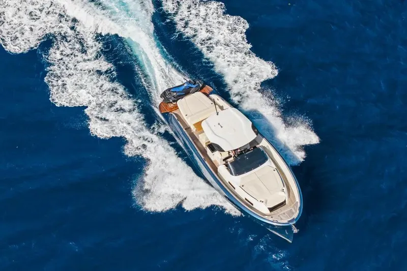 Slide: The Image of 2024 Solaris Power 44 Open yacht cruising on vibrant blue ocean waters. - 2