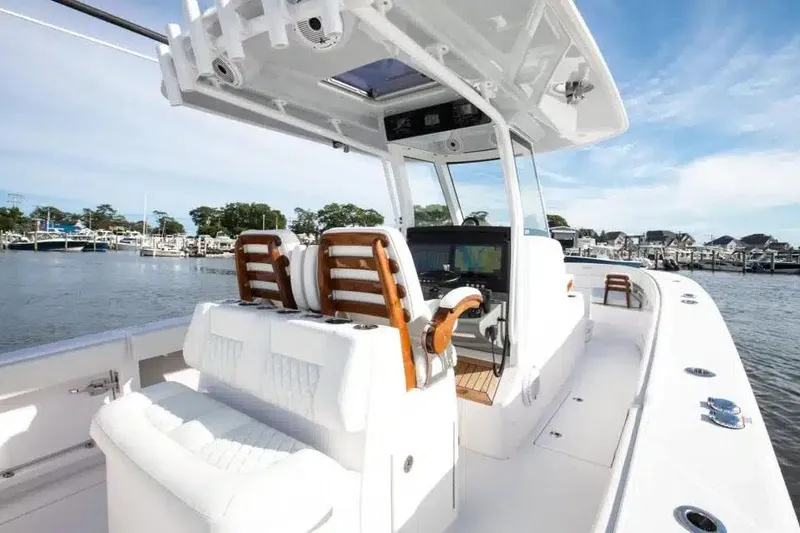 Slide: The Image of Manufacturer Provided Image: 2026 Jupiter 340LS boat with sleek design, luxurious seating, and advanced navigation system. - 11
