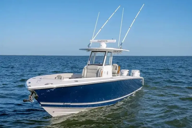 Slide: The Image of Manufacturer Provided Image: 2026 Jupiter 340LS boat on open water, featuring sleek design and advanced navigation equipment. - 6