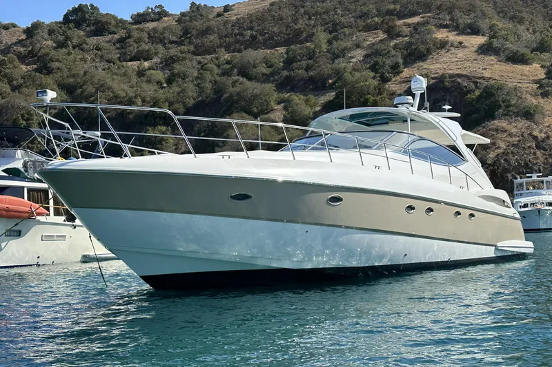 Slide: The Image of 2007 Cruisers Yachts 560 Express in scenic coastal waters, showcasing sleek design and luxury. - 1