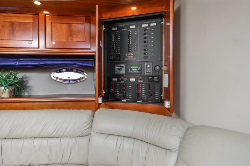 Slide: The Image of 2007 Cruisers Yachts 560 Express interior with control panel and leather seating. - 20