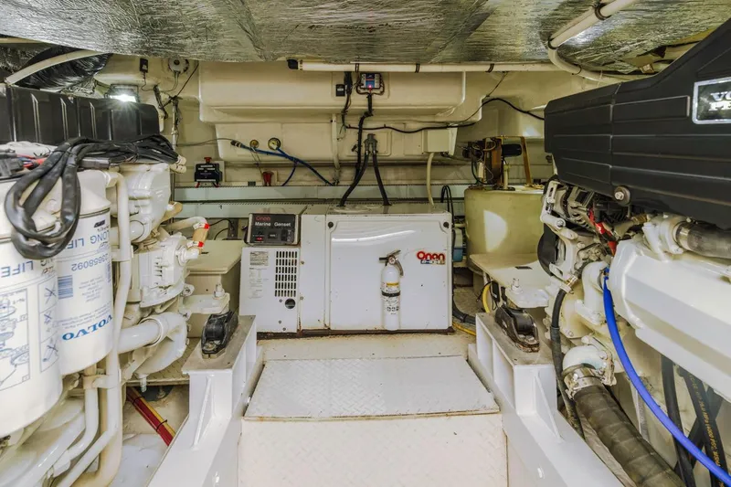 Slide: The Image of Engine room of 2007 Cruisers Yachts 560 Express with Volvo engines and Onan generator. - 30