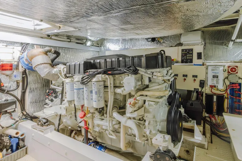 Slide: The Image of Engine room of 2007 Cruisers Yachts 560 Express, showcasing detailed mechanical components. - 34