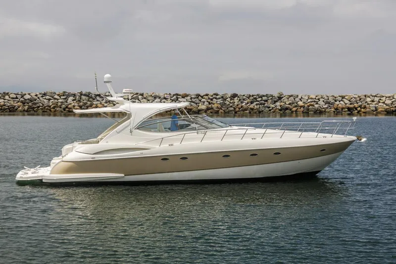 Slide: The Image of 2007 Cruisers Yachts 560 Express in calm waters, showcasing sleek design and luxury features. - 5