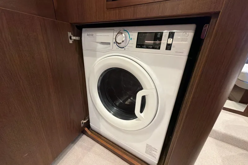Slide: The Image of Built-in washing machine in a 2027 Princess F50 yacht's wooden cabinet. - 124