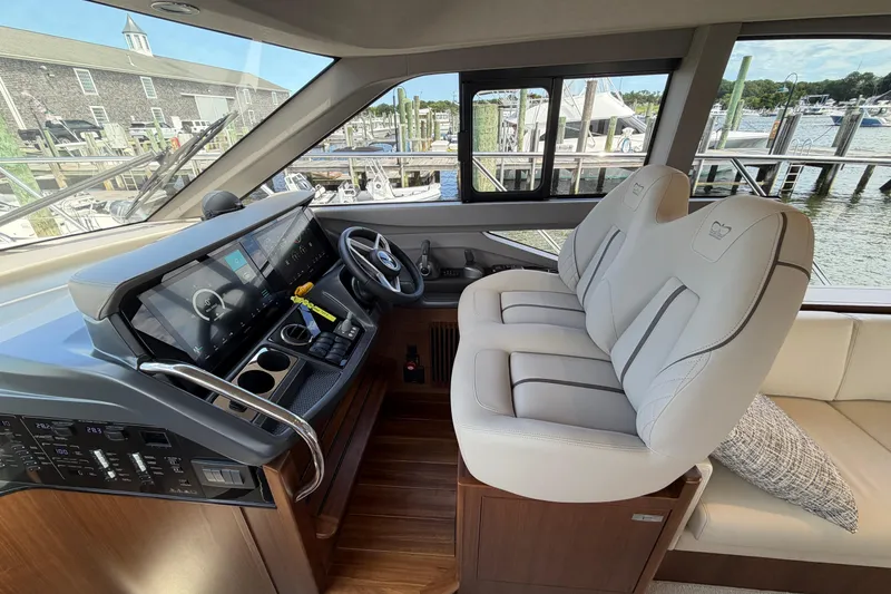 Slide: The Image of Luxurious 2027 Princess F50 yacht interior with modern helm and plush seating. - 86