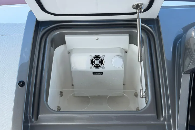 Slide: The Image of Open compartment on 2027 Princess F50 yacht with ventilation fan and latch mechanism. - 62