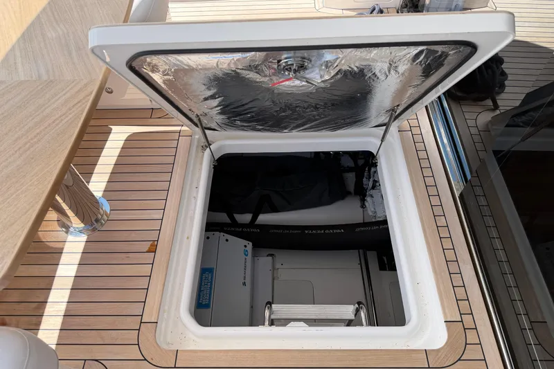 Slide: The Image of Open hatch on 2027 Princess F50 yacht deck, revealing storage compartment. - 29