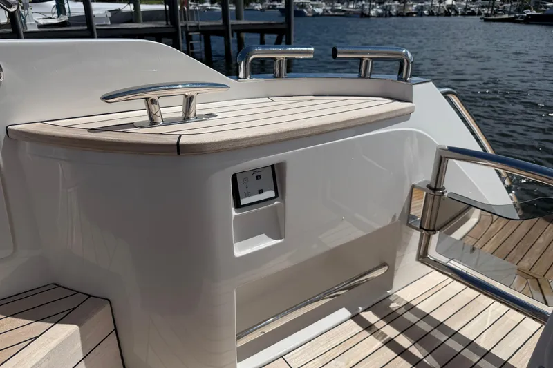 Slide: The Image of Luxury yacht Princess F50, 2027 model, featuring sleek deck design and modern railing. - 24