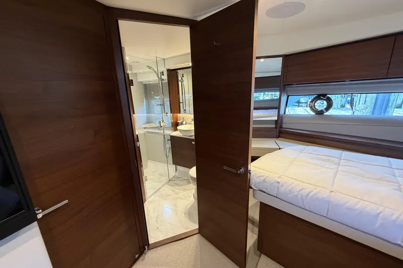 Slide: The Image of Luxurious interior of 2027 Princess F50 yacht featuring bedroom and bathroom. - 102