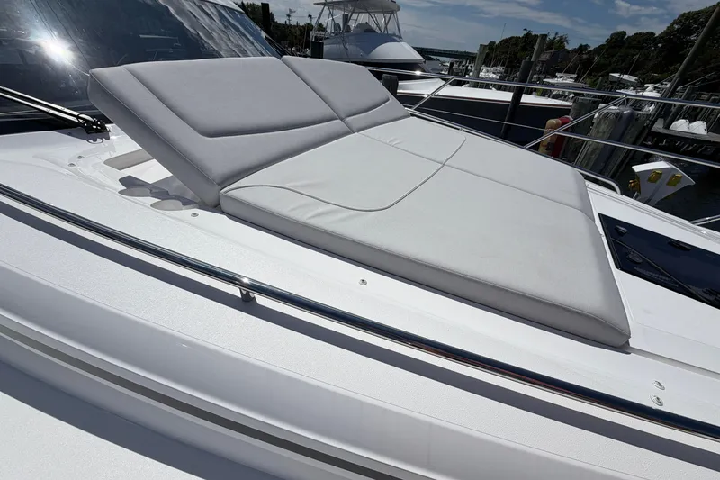 Slide: The Image of Luxurious sunbed on 2027 Princess F50 yacht, docked at marina under clear skies. - 47
