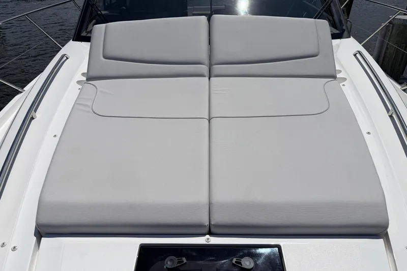Slide: The Image of Sunbathing deck on 2027 Princess F50 yacht, featuring sleek gray cushions. - 45